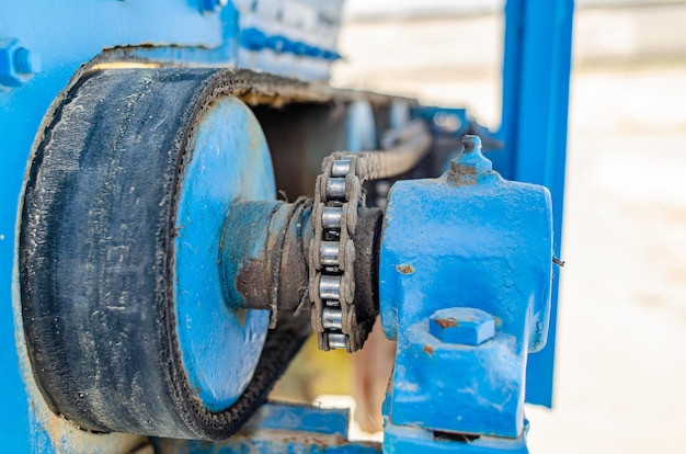 Chain transmission Chain on old equipment Industrial background of worn chain device