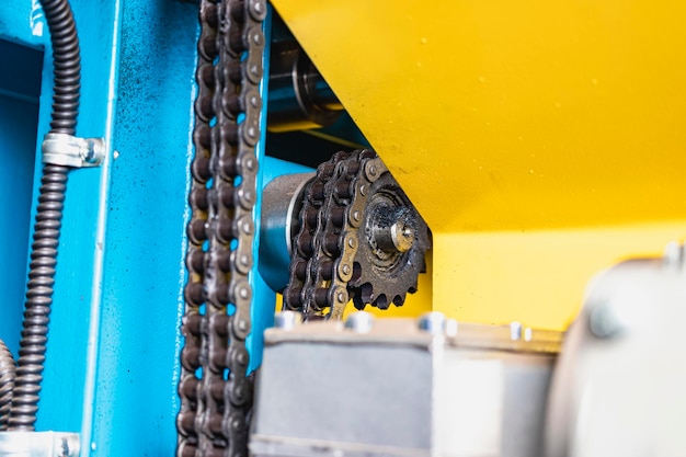 Chain transmission on an industrial machine elements of the\
machine closeup for bending sheet steel industrial equipment for\
metalworking
