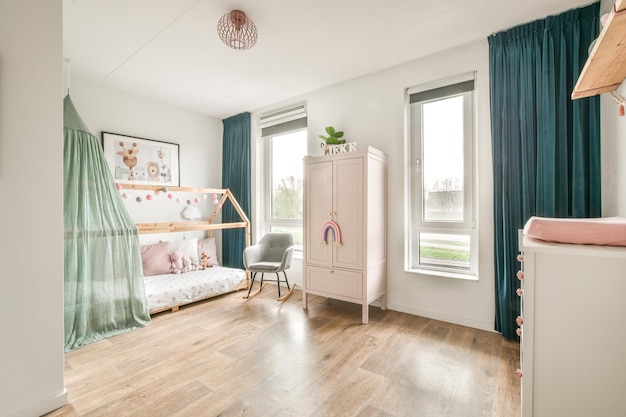 Chair and lamp near window in child room