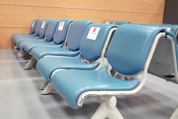 Chair for passenger with social distancing sticker on the chair\
coronavirus protect and prevent disease social distancing\
concept
