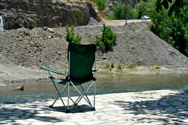 Photo chair on rock by lake