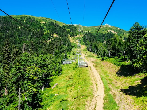 chairlift high in the Caucasus Mountains Krasnaya Polyana Sochi Russia in summer