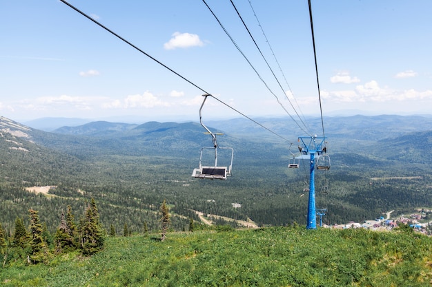 Chairlift, view from high mountain, summer landscape