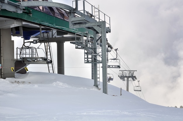 Chairlifts in snowy mountain 