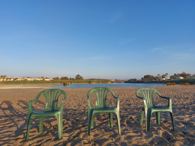 chairs in the sand on the beach