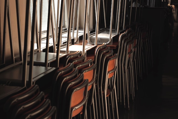 Photo chairs stacked in room