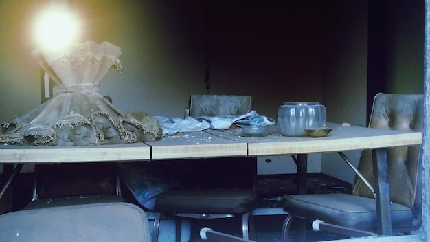 Photo chairs and table in abandoned room