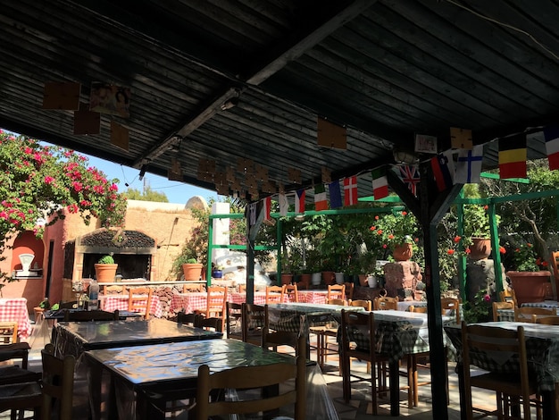 chairs and table arranged at sidewalk cafe