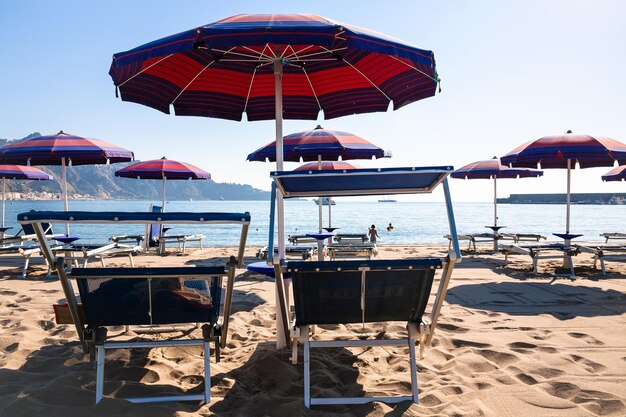 Chairs on urban beach in giardini naxos town