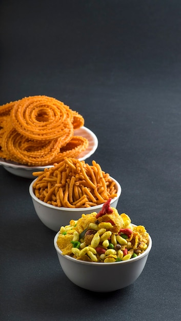 Chakli, chakali or Murukku and Besan (Gram flour) Sev and chivada or chiwada.