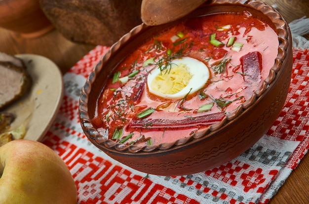 Chaladnik ,cold borscht made of beets, beet leaves or sorrel and served with sour cream, Belarusian  cuisine, Traditional assorted dishes, Top view.