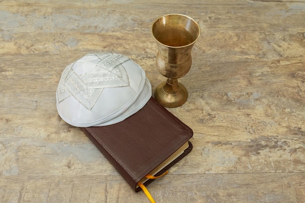 Chalice with red wine and torah