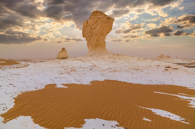 Chalk rocks in the White Desert at sunset Egypt Baharia