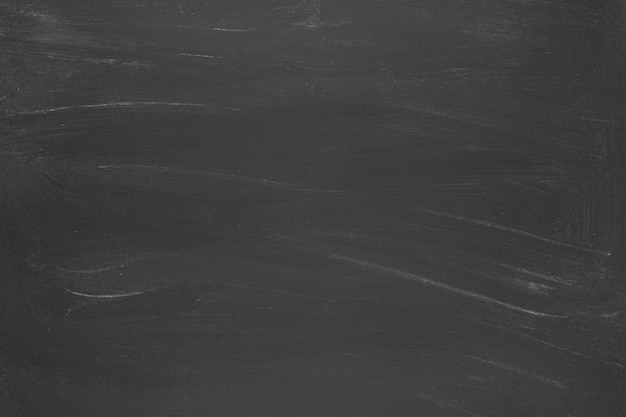 テキストの黒板背景。チョークの痕跡とテクスチャブラックボード