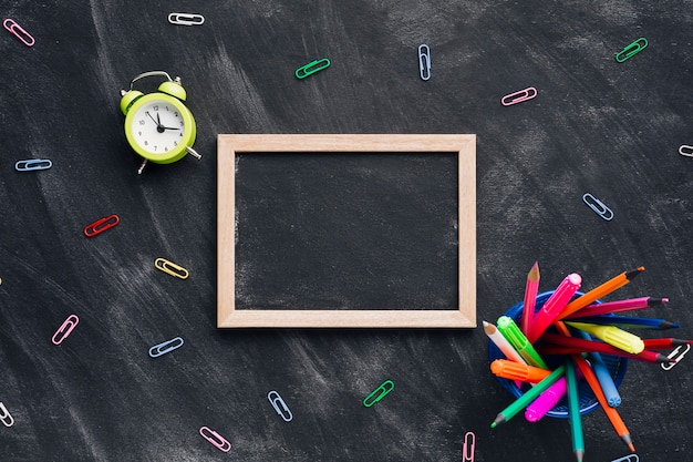 Chalkboard slate surrounded by stationery