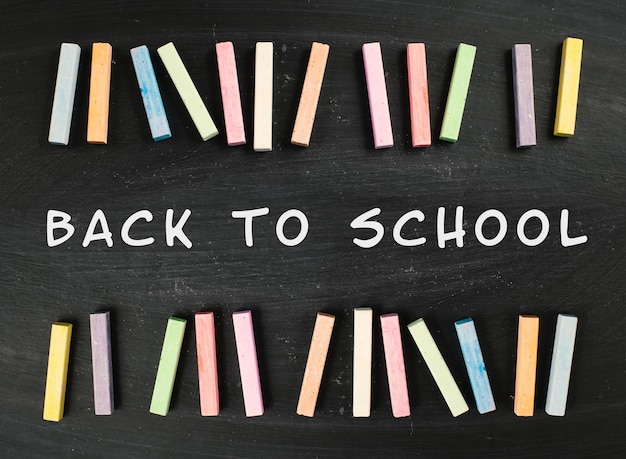 Photo chalkboard with the text back to school, education concept, colorful chalk