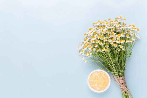 Chamomile aromatherapy theme , handmade cosmetic. space for textessential  and medical flowers herbs