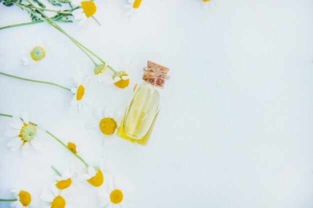 Chamomile extract in a small bottle selective focus