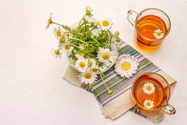 Chamomile tea. Fresh flowers, summer hot drink concept. Alternative medicine, lifestyle