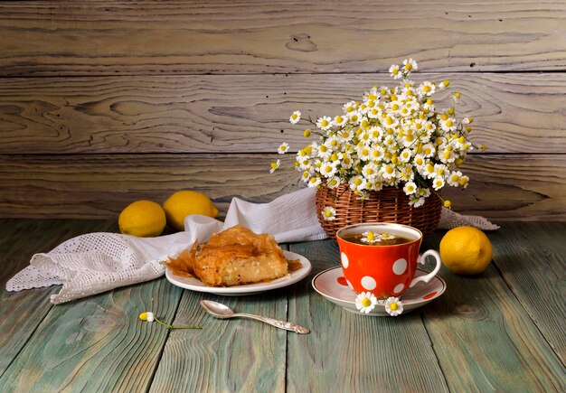 Chamomile tea on a wooden table