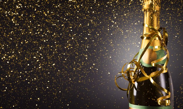 Champagne bottle on christmas shiny background