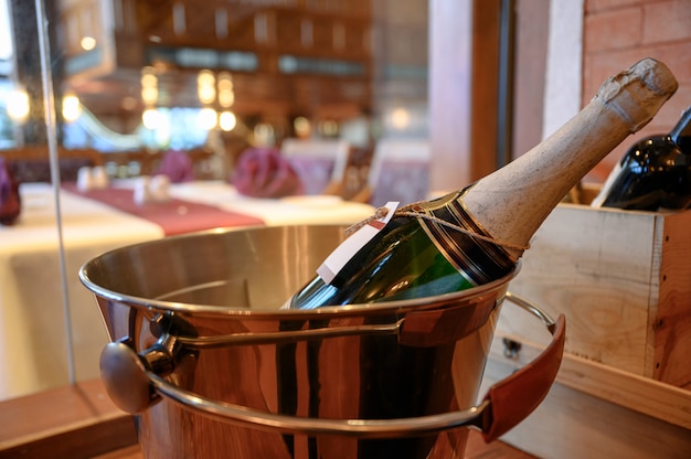 Champagne bottle soaking in bucket