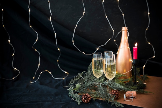 Champagne bottle with green branches 