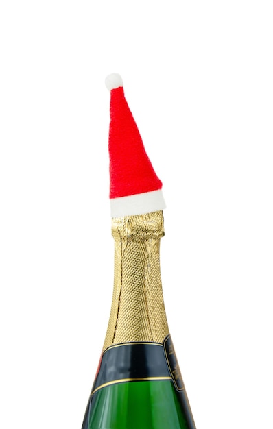 Champagne bottle with red santa cap Red santa claus hat on champagne bottle isolated on white