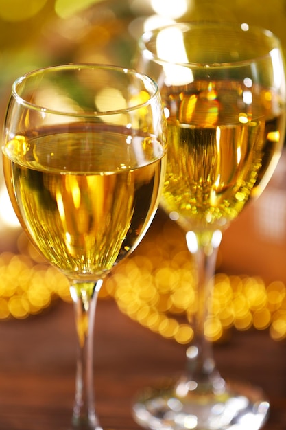 Champagne and Christmas decoration on bright background