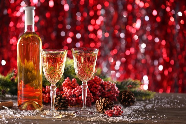 Champagne and Christmas decoration on bright background