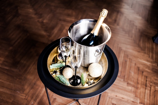  Champagne in a cooling bucket with glasses 