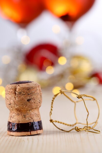 Champagne cork on Christmas lights background