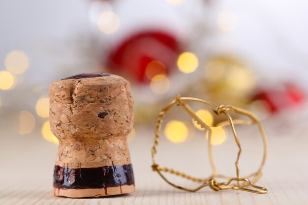 Champagne cork on Christmas lights background