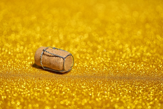 Champagne cork on a golden bokeh.New Year's concept.