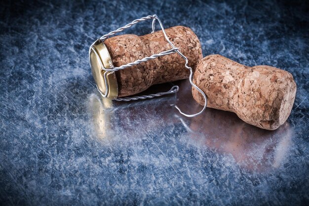 Champagne cork stoppers twisted wire on metallic background alcohol concept