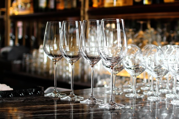 Champagne flutes arranged at bar counter