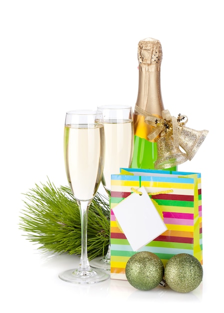 Champagne, gift and christmas decor. Isolated on white background