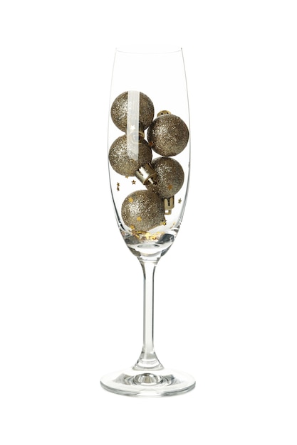 Champagne glass with baubles isolated on white