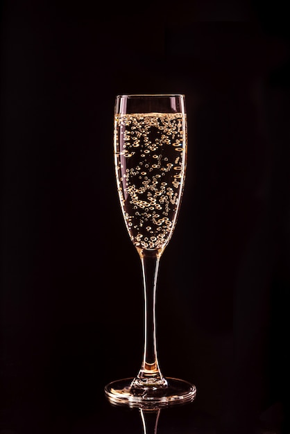 champagne glass with bubbles with reflection