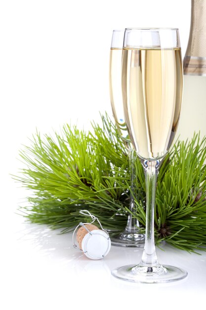 Champagne glasses bottle and fir tree