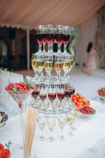 Champagne glasses. Wedding slide champagne for bride and groom.  Catering service.