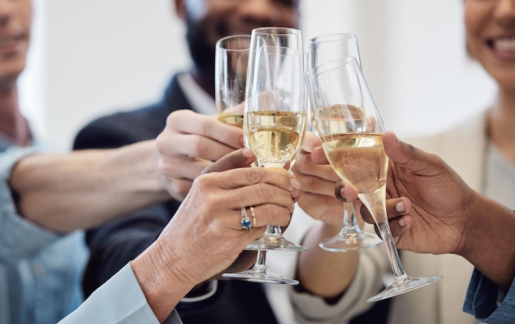 Photo champagne toast and business people for celebration success and social event company party and happy career wine glasses alcohol and professional woman men or team hands cheers for work goals