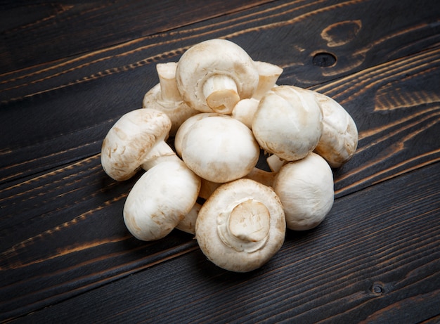 Champignon mushroom on wooden table