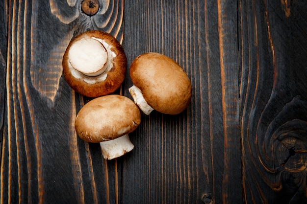 Champignon mushroom on wooden table