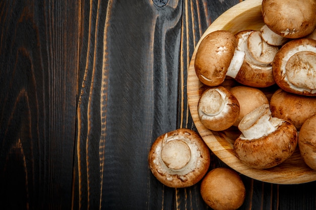 Champignon mushroom on wooden table