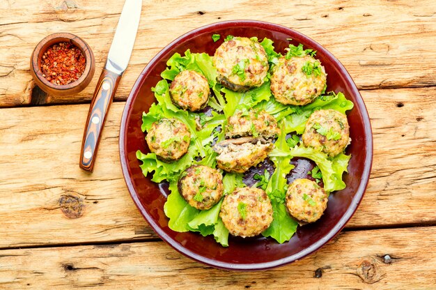 Champignon mushrooms stuffed with ground beef.Italian food.