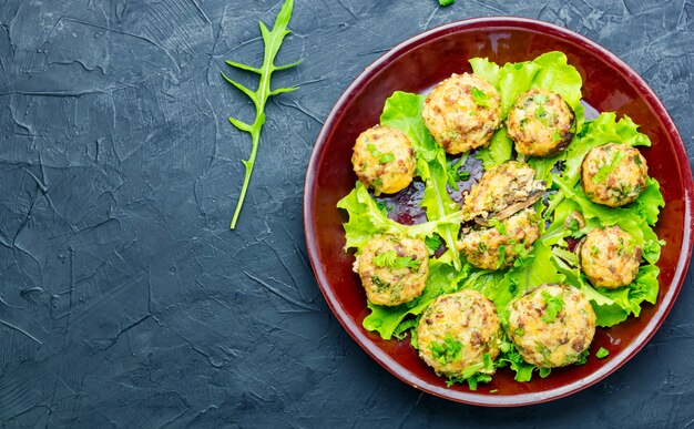 Champignon mushrooms stuffed with ground beef.Italian food.