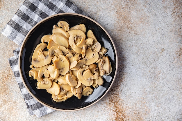 champignon plakjes champignons maaltijd eten snack op tafel kopie ruimte voedsel achtergrond rustiek bovenaanzicht