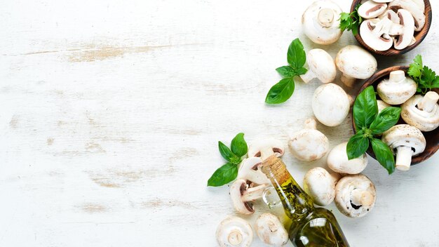 Champignons with spices on the old kitchen table Top view Free space for text