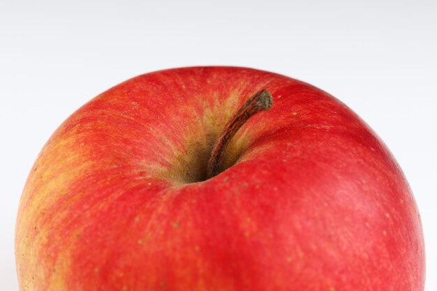 Champion apple on a white surface